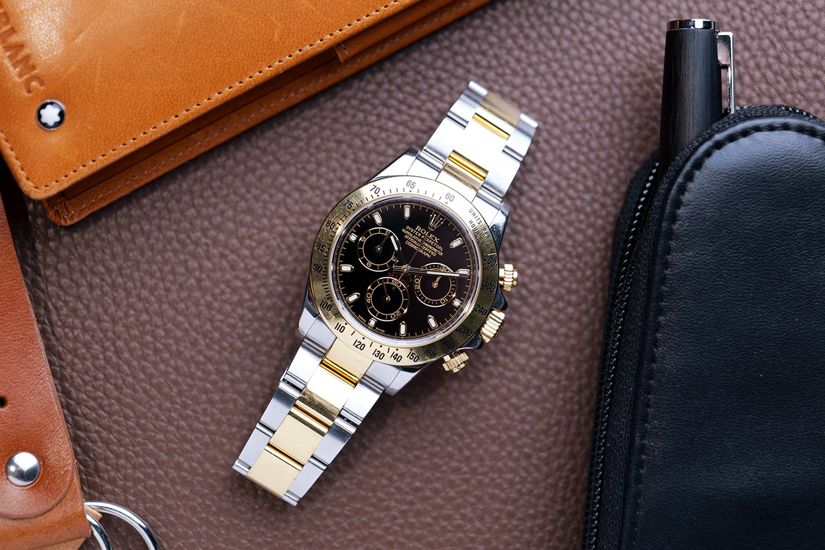 PRE-OWNED Rolex Daytona Gold & Steel 116523