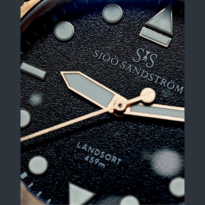 Sjöö Sandström Landsort Bronze & gummiband 021484