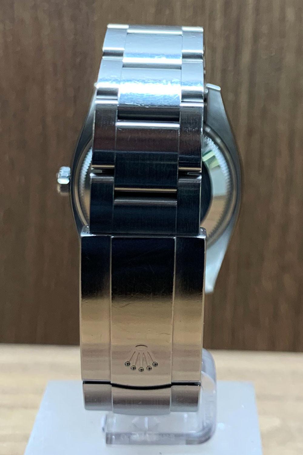 BEGAGNAD Rolex Oyster Perpetual 34 mm, silver och stålarmband 114200