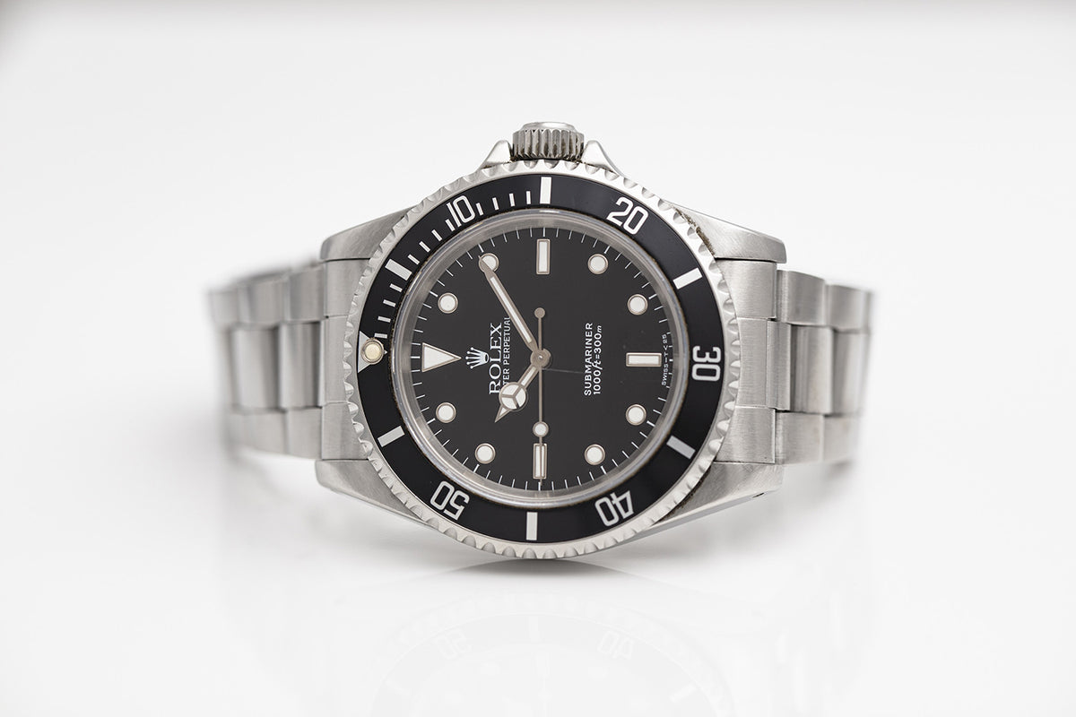 PRE-OWNED Rolex Submariner 40mm Black Dial Steel 14060