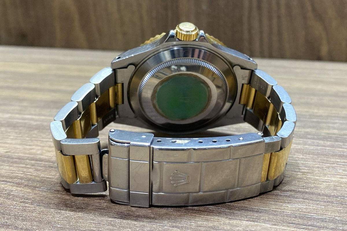 PRE-OWNED Rolex Submariner Steel & Gold 16613